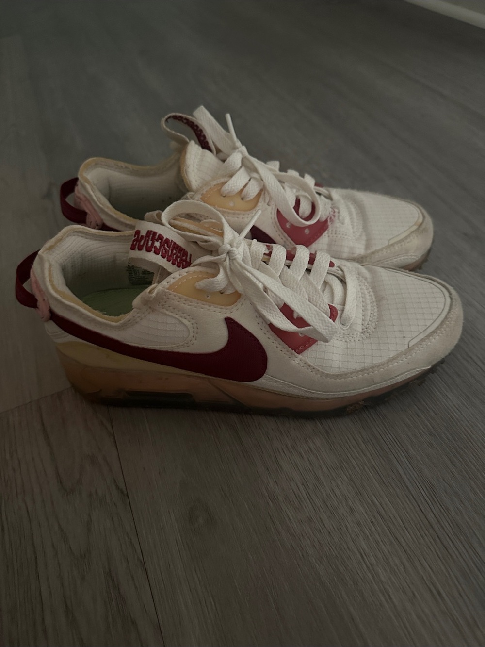 Nike White Sneakers with Burgundy Swoosh and Pink Accents